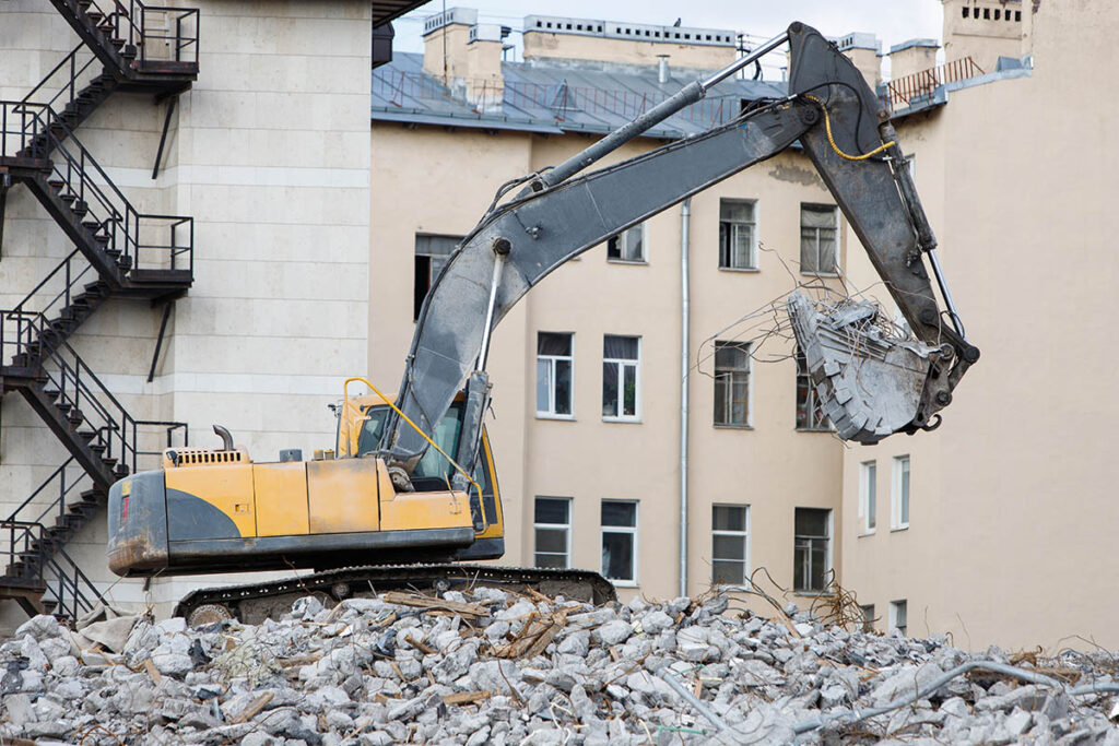 A building demolition with hydraulic excavator