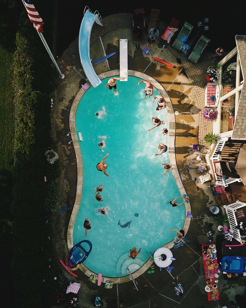 A high angle view of a pool during a party.
